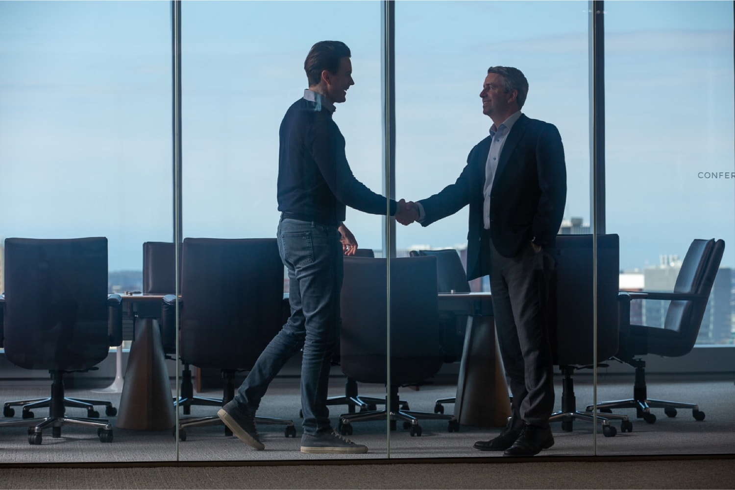 Two business professionals shaking hands